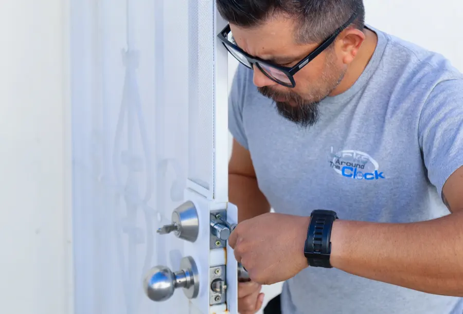 Thomas, senior field technician at Locks Around the Clock, installing a lock cylinder on a residential door